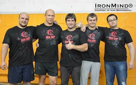 (Left to right) Pavel Khatuntsev, Alexander Yuzvik, Alexey Pritula, Vladimir Abrikosov and Ruben Piliposyan are part of the Iron Grip community and in a first, under the watchful eye of referee Alexei Ovsiannikov, all five took their official attempts on the IronMind Red Nail at the same time and all five succeeded.  IronMind&reg; | Photo courtesy of Ivan Beritashvili