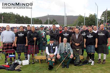 2013 Royal Braemar Highland Games group photo: heavy events winner Scott Rider is third from the left, front row.  IronMind&reg; | Photo courtesy of Alistair Gunn