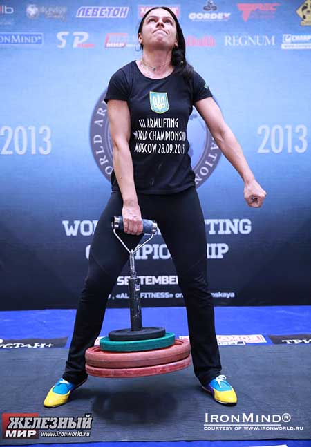 Iryna Postnikova attacks 68 kg on the Rolling Thunder&reg; at the 2013 Armlifting World Championships.  IronMind&reg; | Photo courtesy of www.ironworld.ru.