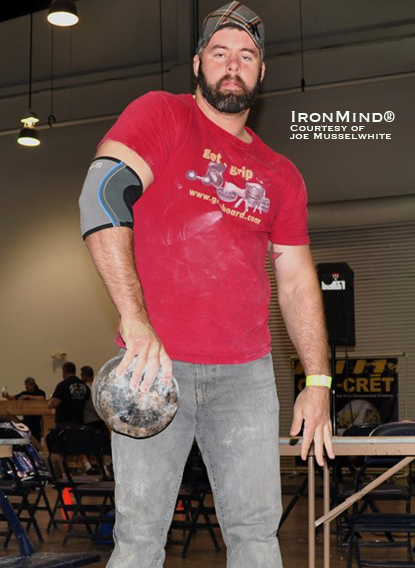 Paul Knight lofts the Blob, showing that his thumb strength is right in there with his other four fingers.  Knight has just re-certified on the No. 3 Captains of Crush (CoC) Gripper.  IronMind&reg; | Photo courtesy of Joe Musselwhite.