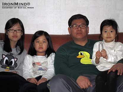 “Look at what my dad can do?” Sun-gil Gwon’s daughter holds up the IronMind Red nail that her father officially bent. IronMind® | Photo courtesy of Sun-gil Gwon. “Look at what my dad can do?” Sun-gil Gwon’s daughter holds up the IronMind Red nail that her father officially bent. IronMind® | Photo courtesy of Sun-gil Gwon.
