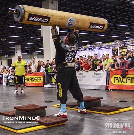 The Log Lift King, Zydrunas Savickas, doing his thing at the FIBO.  IronMind&reg; | Photo courtesy of Strongman Rage