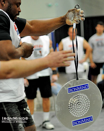 Mark Felix’s hand opens on the Captains of Crush No. 3 gripper and referee Mike Corlett signals for time as the CoC Silver Bullet is launched: Felix is credited with the inaugural world record as he held on for 43.25 seconds at the 2012 LA FitExpo. IronMind® | Randall J. Strossen photo. Mark Felix’s hand opens on the Captains of Crush No. 3 gripper and referee Mike Corlett signals for time as the CoC Silver Bullet is launched: Felix is credited with the inaugural world record as he held on for 43.25 seconds at the 2012 LA FitExpo. IronMind® | Randall J. Strossen photo.